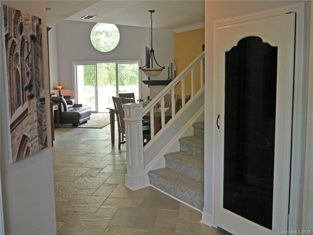 17925 Kings Point Drive, Unit F Cornelius, NC 28031 - Photo 21 of 36 a view of entryway and hall with wooden floor