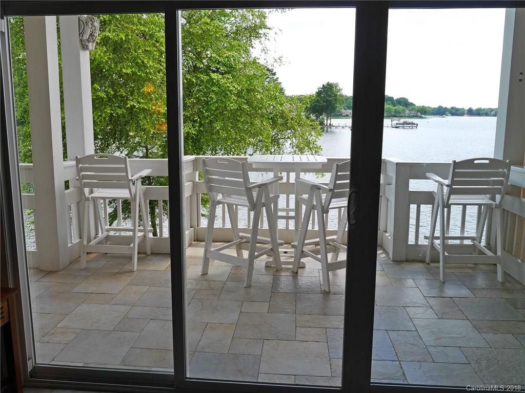 17925 Kings Point Drive, Unit F Cornelius, NC 28031 - Photo 22 of 36 a view of a balcony with chairs