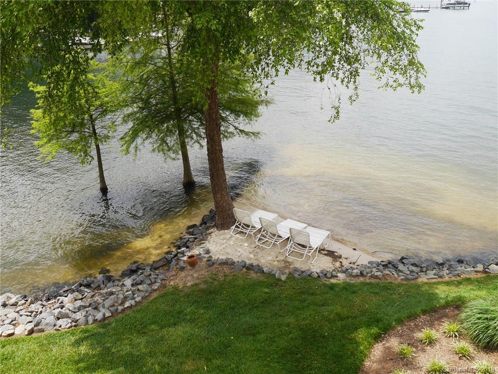 17925 Kings Point Drive, Unit F Cornelius, NC 28031 - Photo 24 of 36 a view of a yard with an outdoor space
