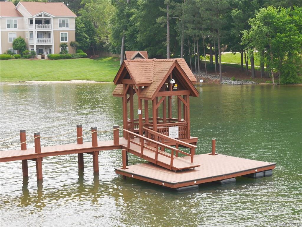 17925 Kings Point Drive, Unit F Cornelius, NC 28031 - Photo 25 of 36 a view of a lake with a house next to a lake with a lake view