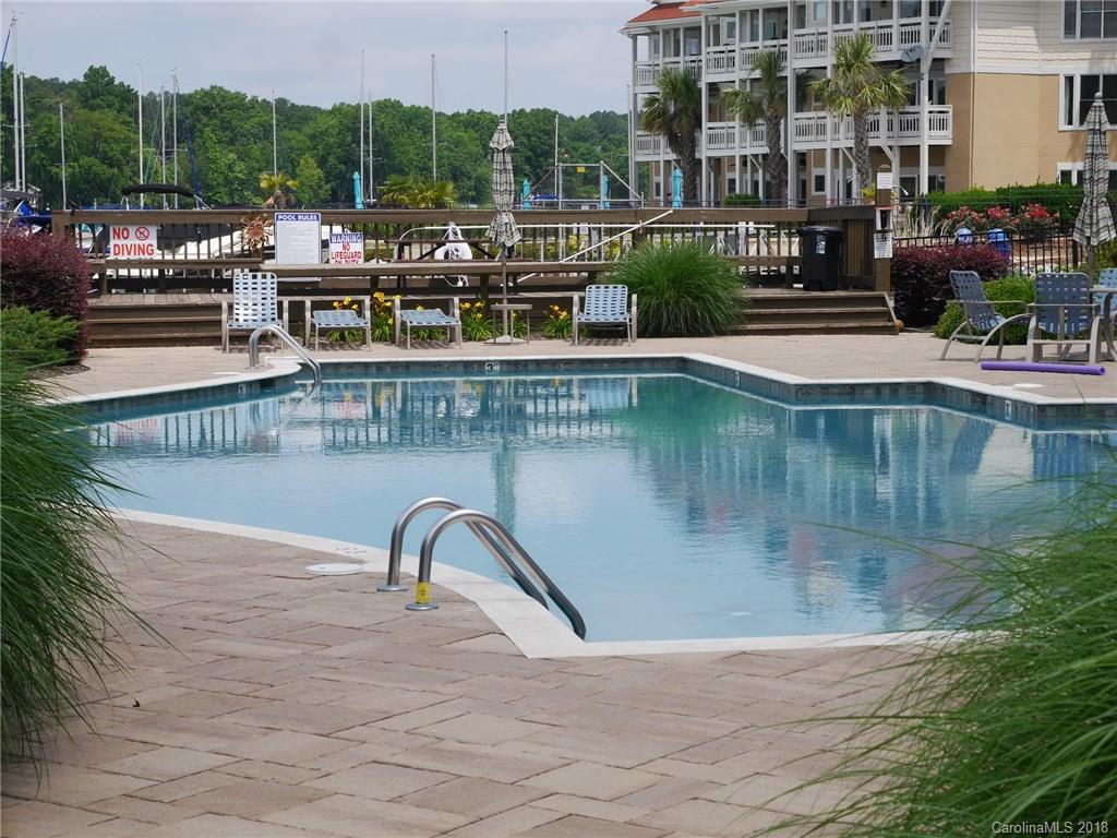 17925 Kings Point Drive, Unit F Cornelius, NC 28031 - Photo 28 of 36 a view of swimming pool with outdoor seating and plants