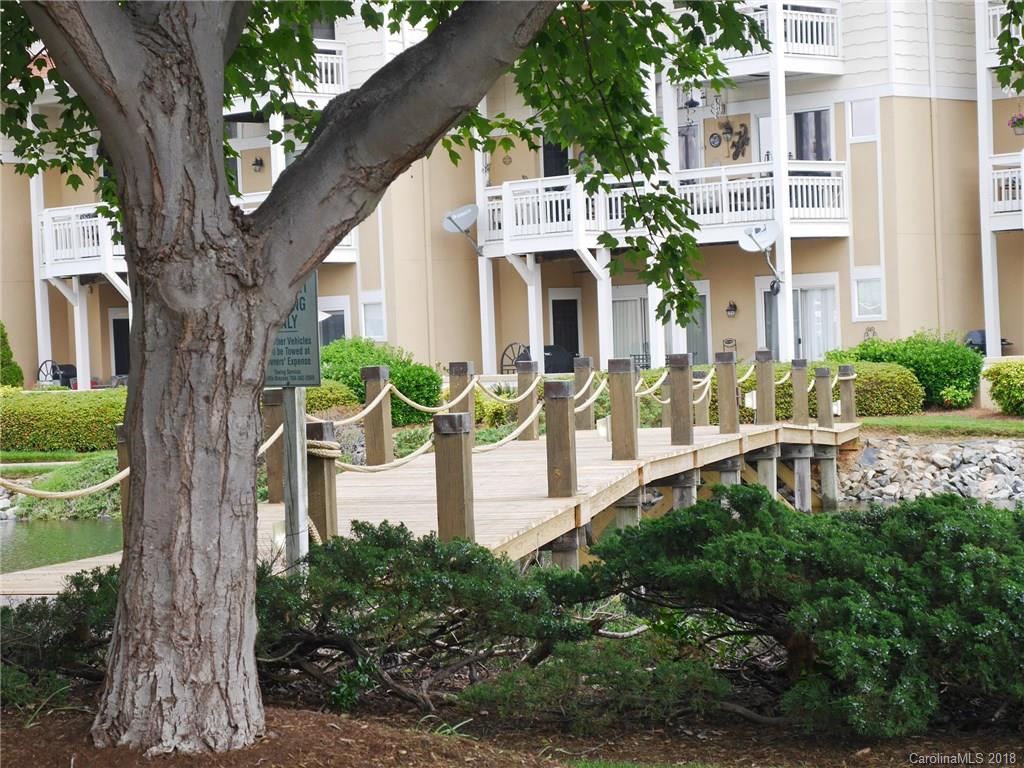 17925 Kings Point Drive, Unit F Cornelius, NC 28031 - Photo 29 of 36 a front view of a house with a yard