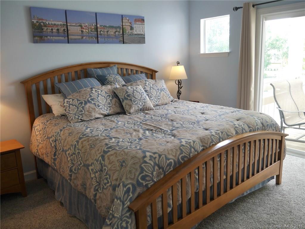 17925 Kings Point Drive, Unit F Cornelius, NC 28031 - Photo 5 of 36 a bedroom with a bed and a window