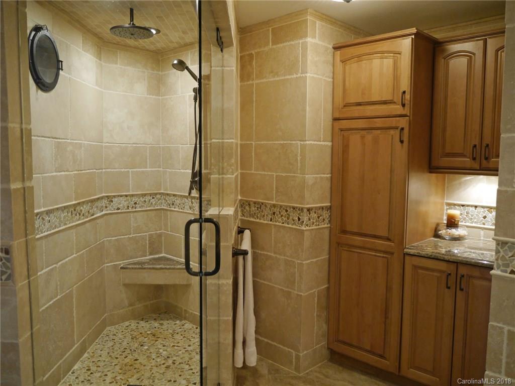 17925 Kings Point Drive, Unit F Cornelius, NC 28031 - Photo 9 of 36 a bathroom with a shower