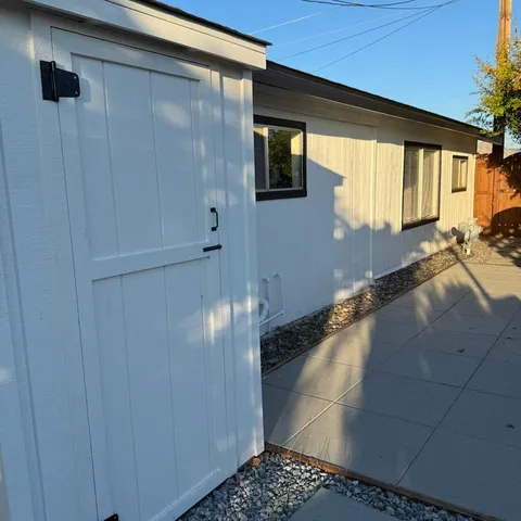 a balcony with trees in front of it
