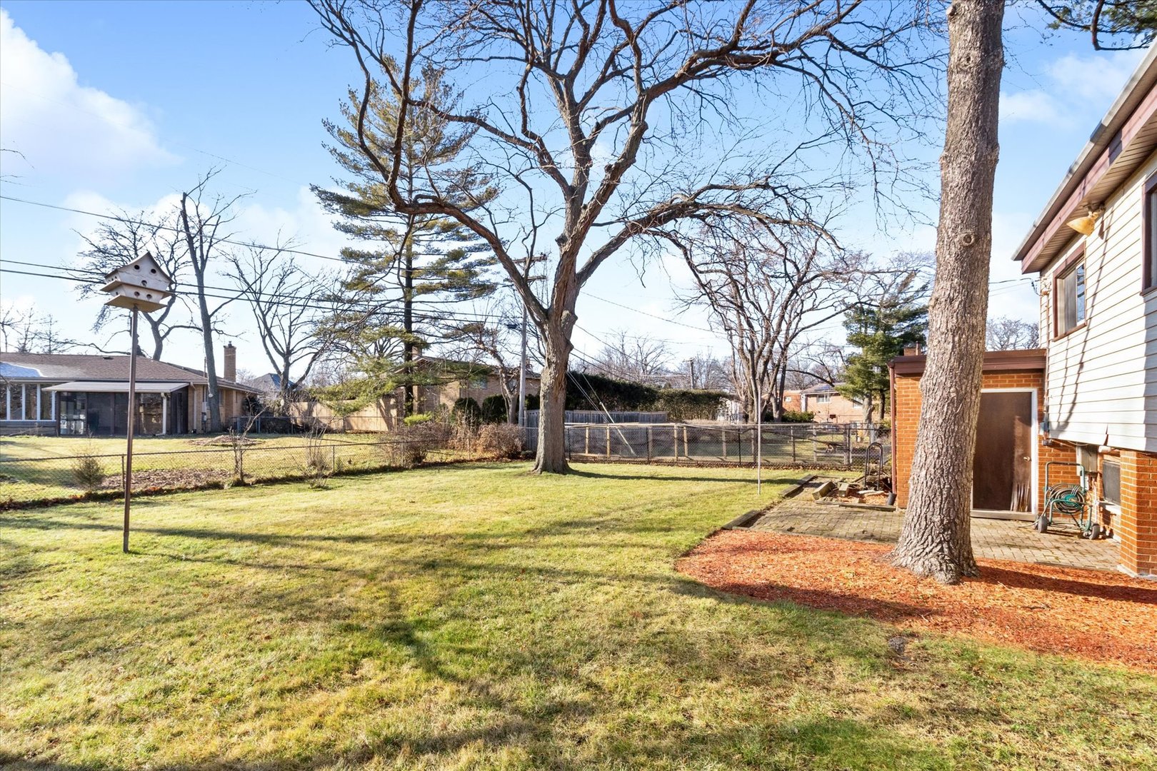 356 East Church Street Elmhurst, IL 60126 - Photo 15 of 16 a view of a swimming pool with a house in the background