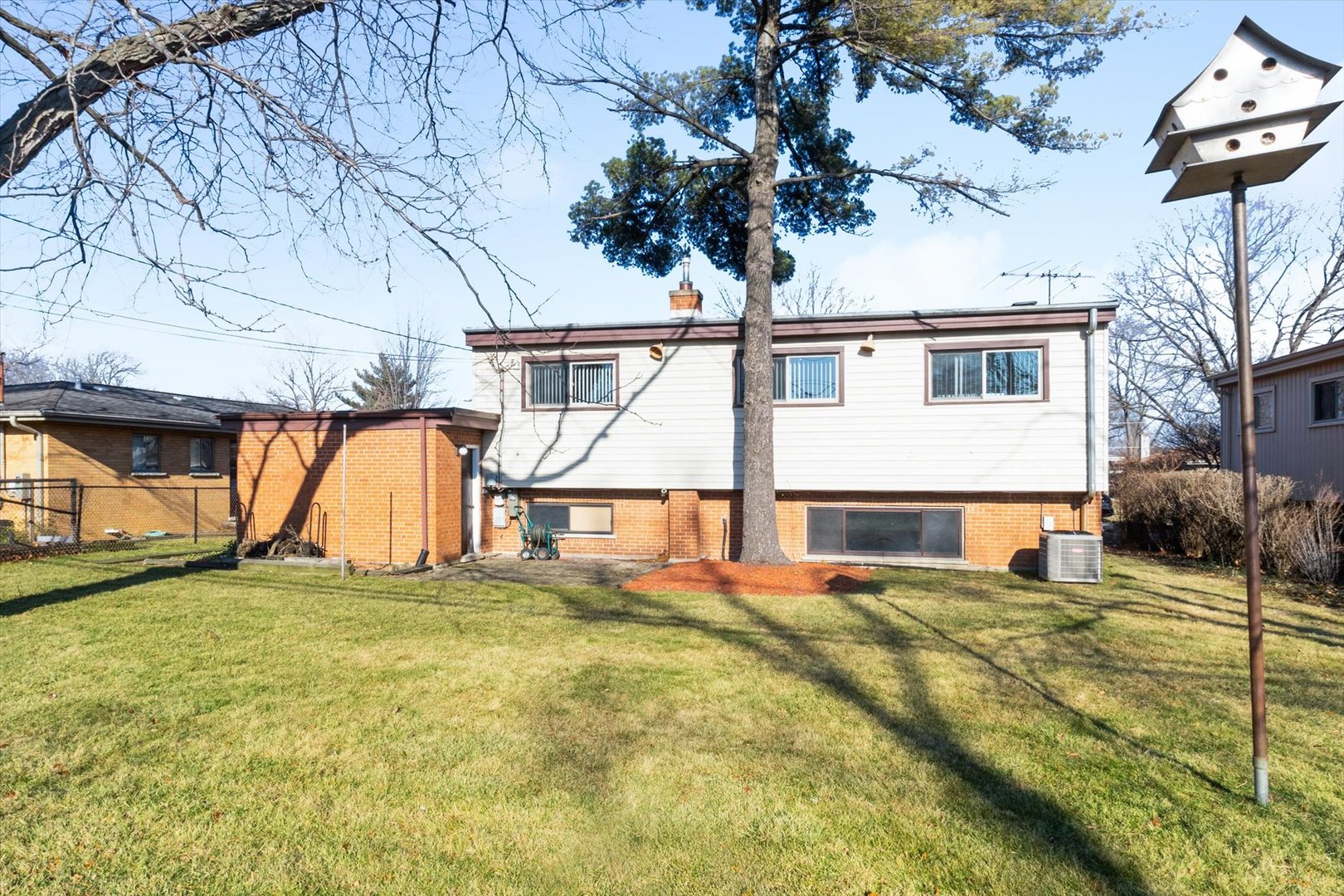 356 East Church Street Elmhurst, IL 60126 - Photo 16 of 16 a view of a house with a big yard and large tree