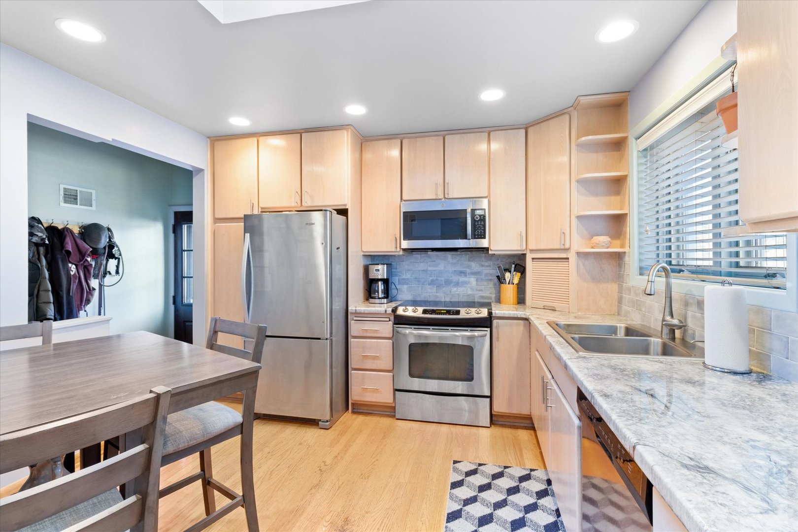 356 East Church Street Elmhurst, IL 60126 - Photo 4 of 16 a kitchen with stainless steel appliances granite countertop a refrigerator a stove top oven a sink and dishwasher