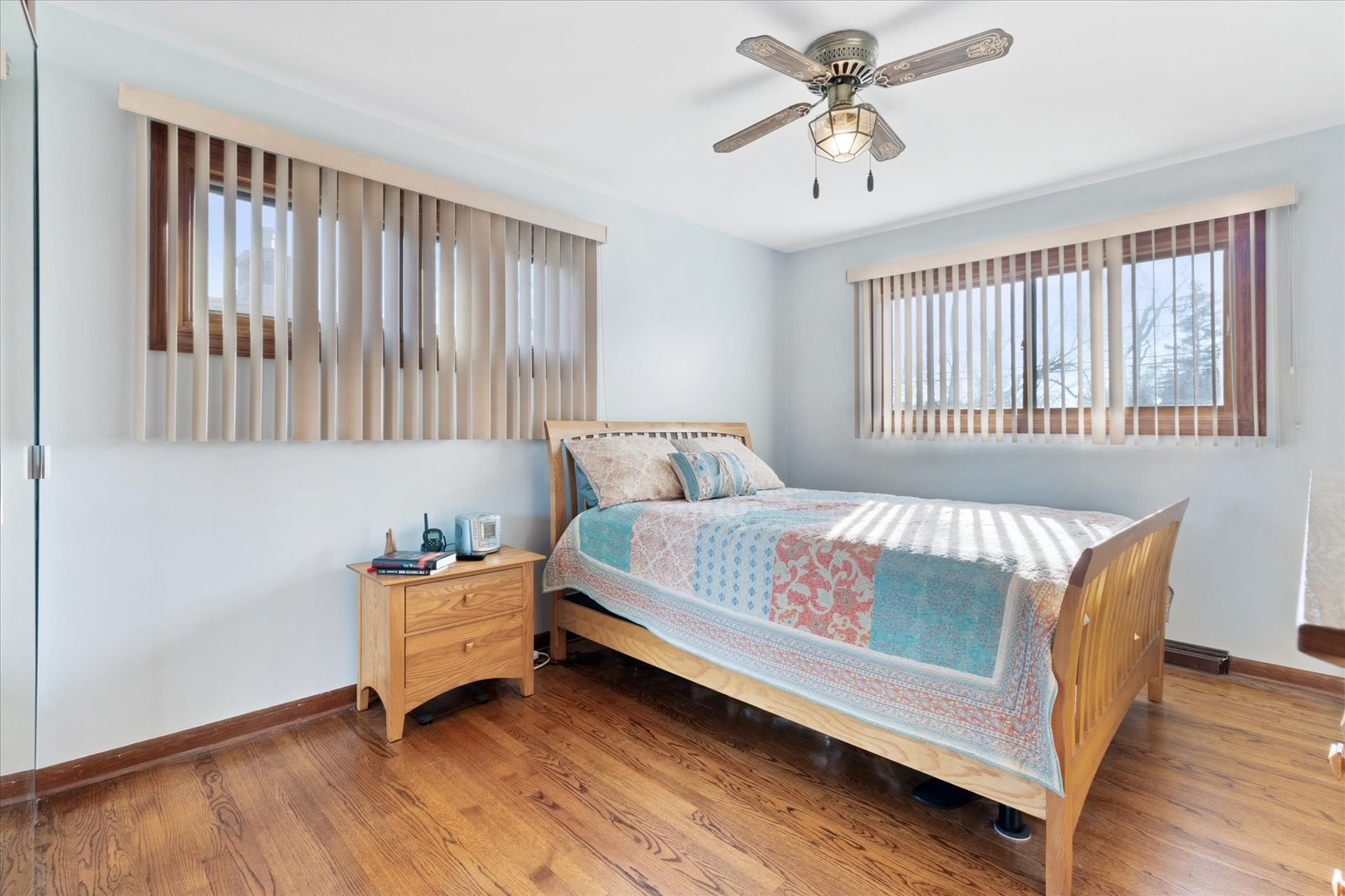 356 East Church Street Elmhurst, IL 60126 - Photo 9 of 16 a bed sitting in a bedroom next to a window