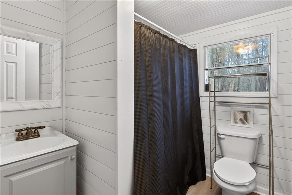 323 Ball Field Road Waleska, GA 30183 - Photo 15 of 39 a bathroom with a toilet a sink and shower