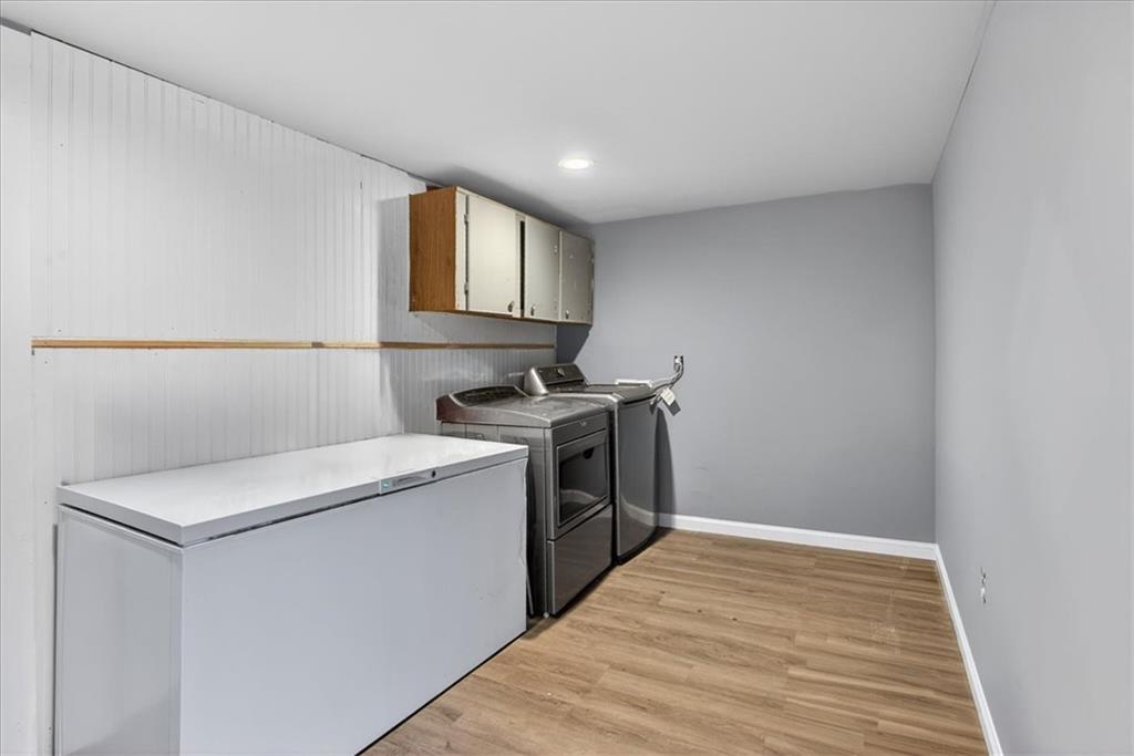 323 Ball Field Road Waleska, GA 30183 - Photo 17 of 39 a kitchen with a stove and a wooden floor