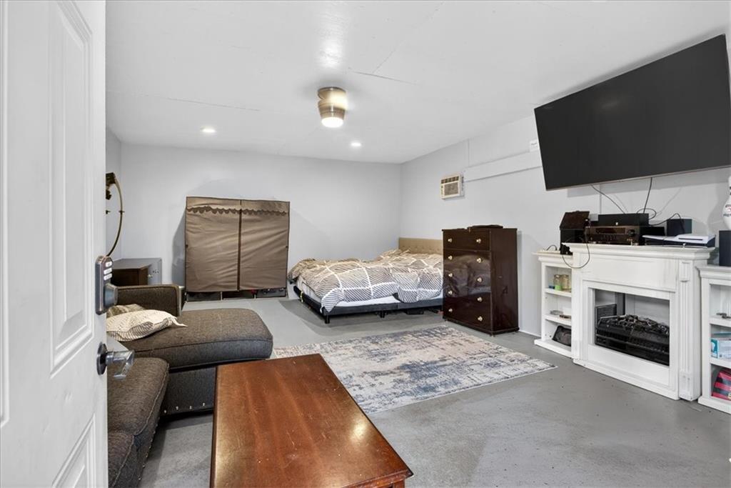 323 Ball Field Road Waleska, GA 30183 - Photo 18 of 39 a bedroom with furniture and a fireplace