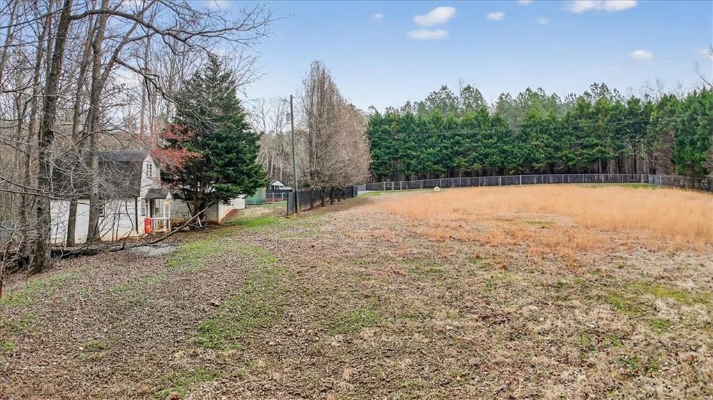 323 Ball Field Road Waleska, GA 30183 - Photo 34 of 39 a view of a field with trees in the background