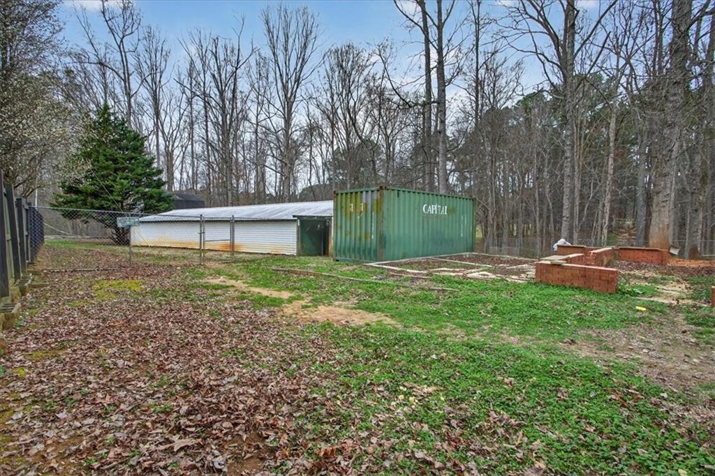 323 Ball Field Road Waleska, GA 30183 - Photo 37 of 39 a view of a backyard with a small cabin