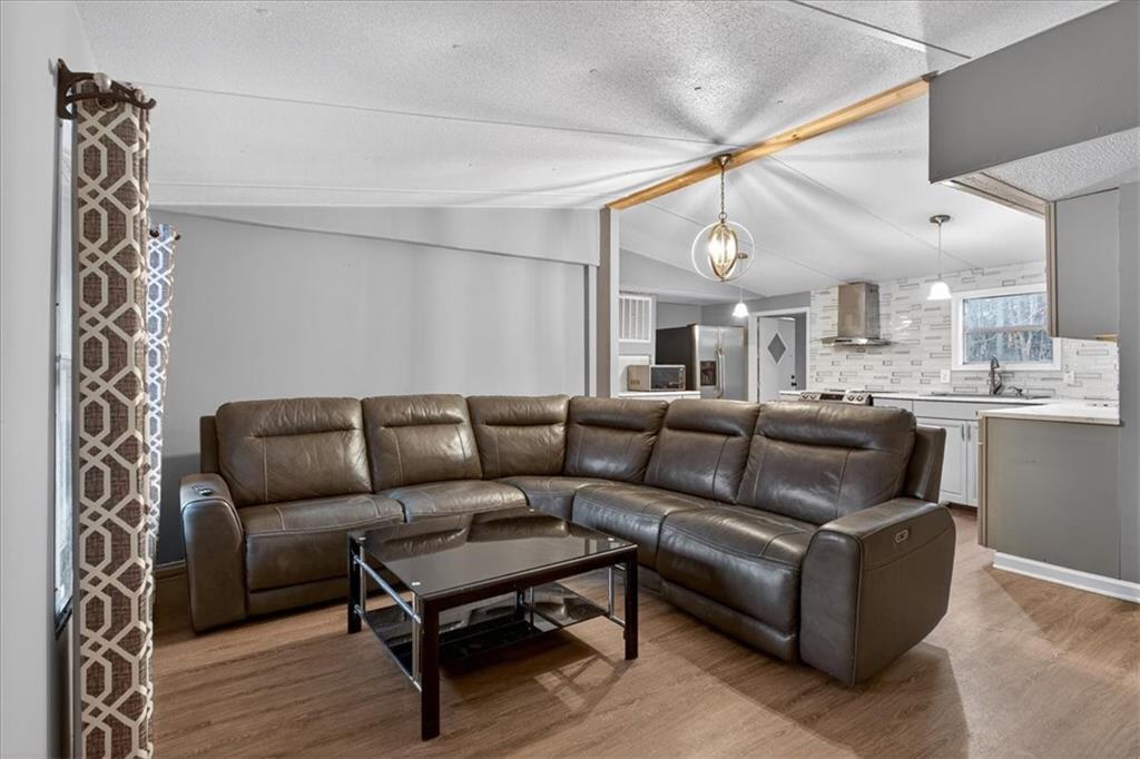 323 Ball Field Road Waleska, GA 30183 - Photo 6 of 39 a living room with furniture and a fireplace