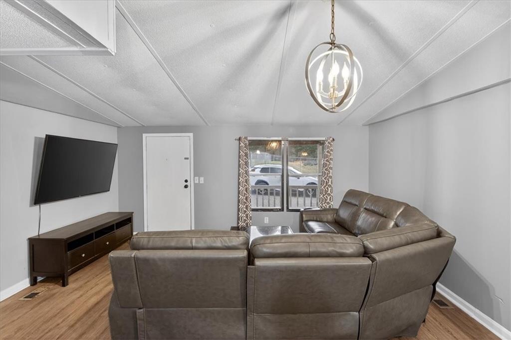 323 Ball Field Road Waleska, GA 30183 - Photo 7 of 39 a living room with furniture and a flat screen tv