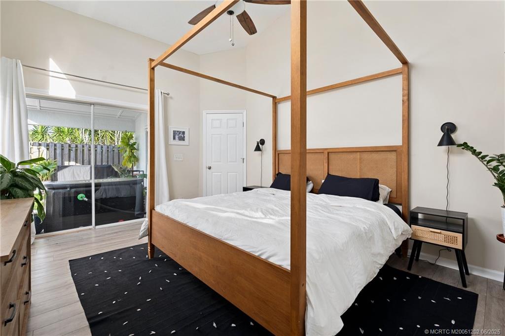 6351 Adams Street Jupiter, FL 33458 - Photo 19 of 42 a bedroom with a bed and a window