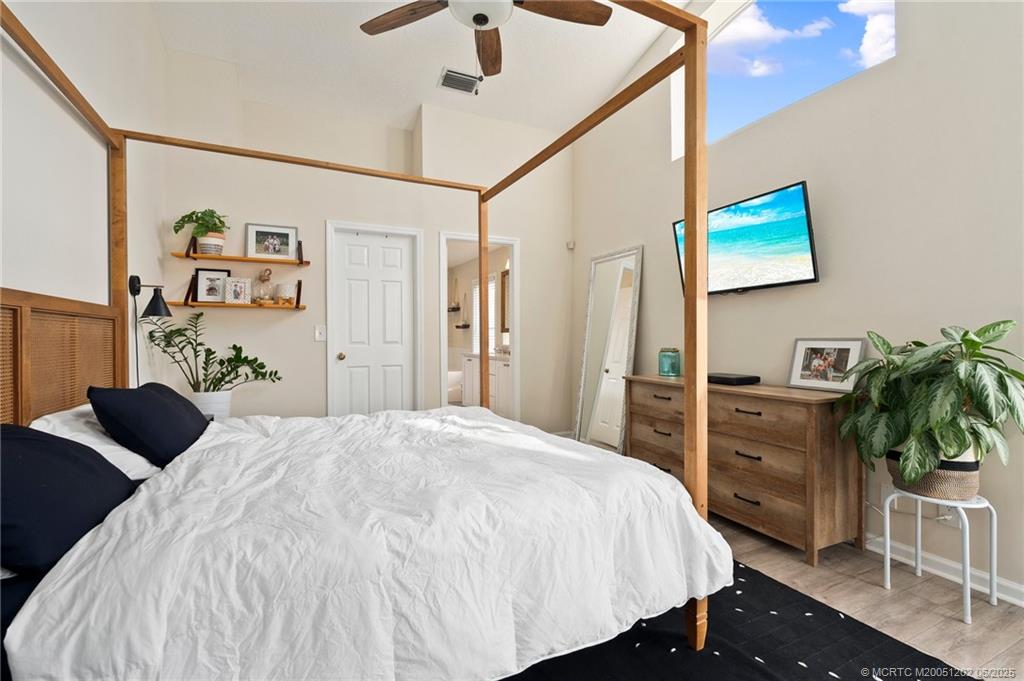 6351 Adams Street Jupiter, FL 33458 - Photo 21 of 42 a bedroom with a bed and a cabinets