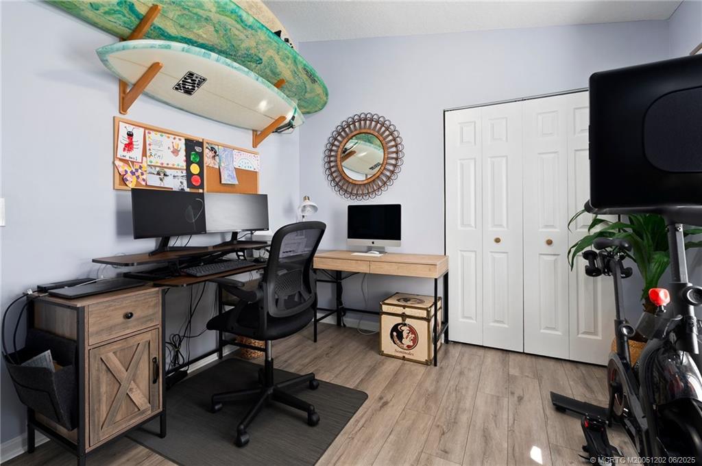 6351 Adams Street Jupiter, FL 33458 - Photo 26 of 42 a view of a workspace with furniture and a window