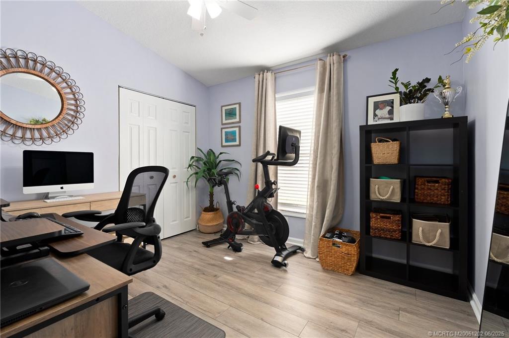 6351 Adams Street Jupiter, FL 33458 - Photo 27 of 42 a view of a workspace with furniture and a window
