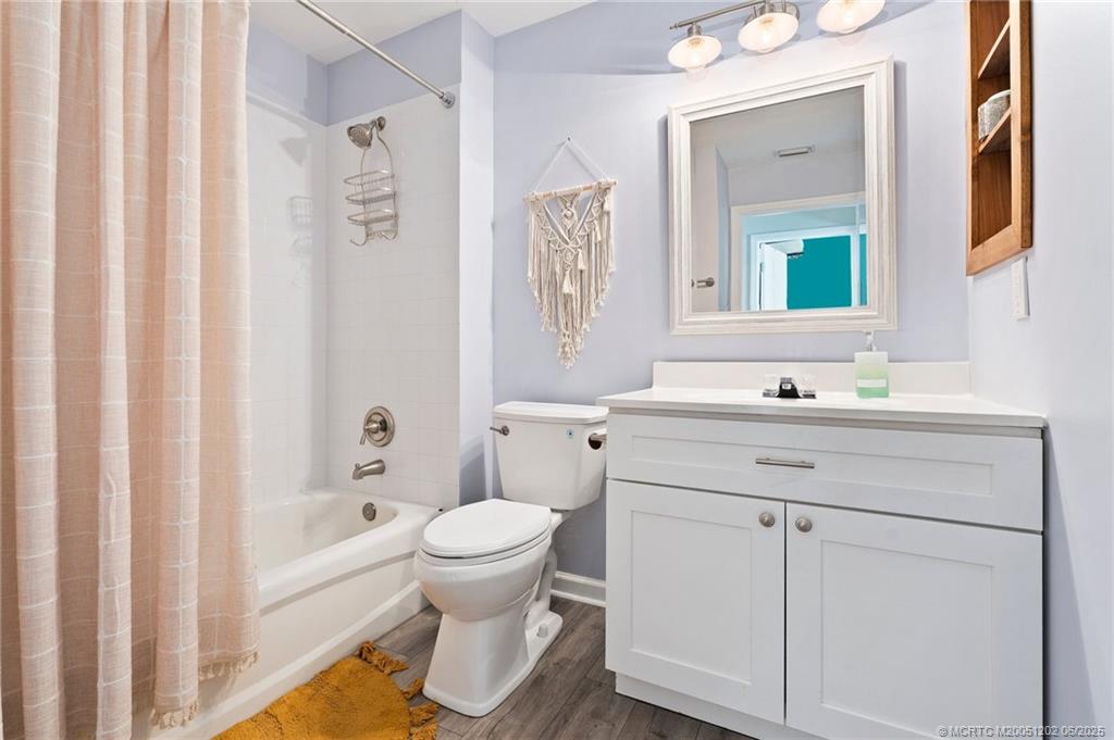 6351 Adams Street Jupiter, FL 33458 - Photo 28 of 42 a bathroom with a sink a toilet and a bathtub