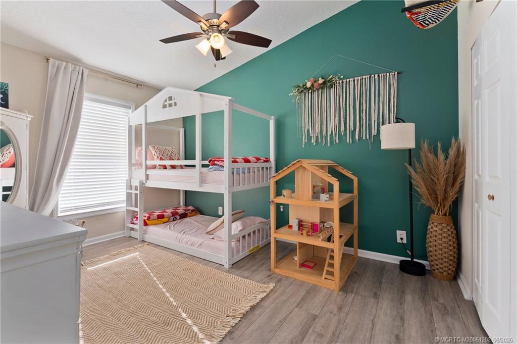 6351 Adams Street Jupiter, FL 33458 - Photo 29 of 42 a living room with furniture a fireplace and a window