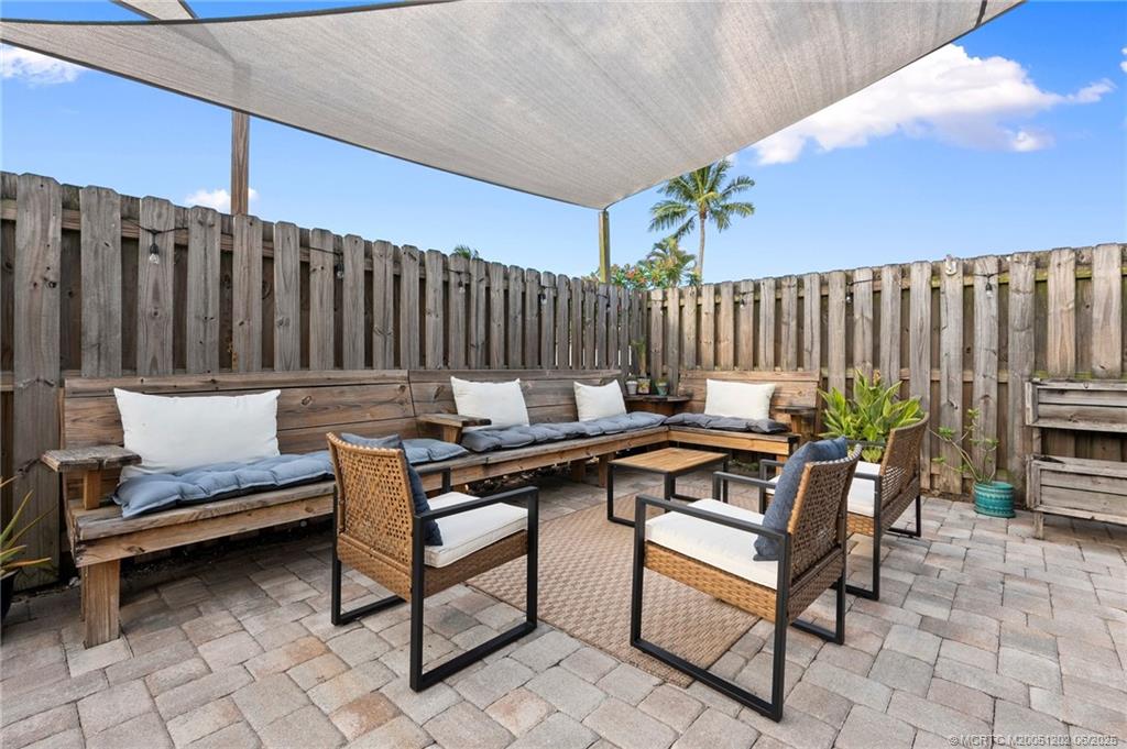 6351 Adams Street Jupiter, FL 33458 - Photo 34 of 42 a view of a chairs and table in the patio