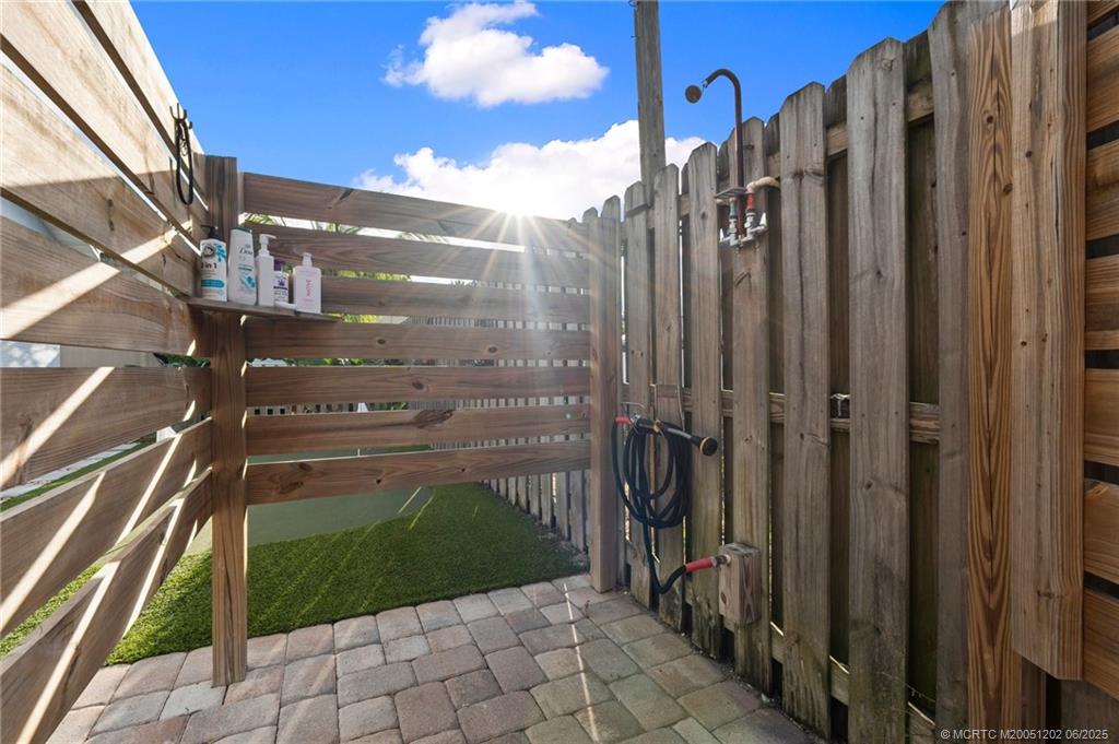 6351 Adams Street Jupiter, FL 33458 - Photo 36 of 42 a view of a pathway of a building