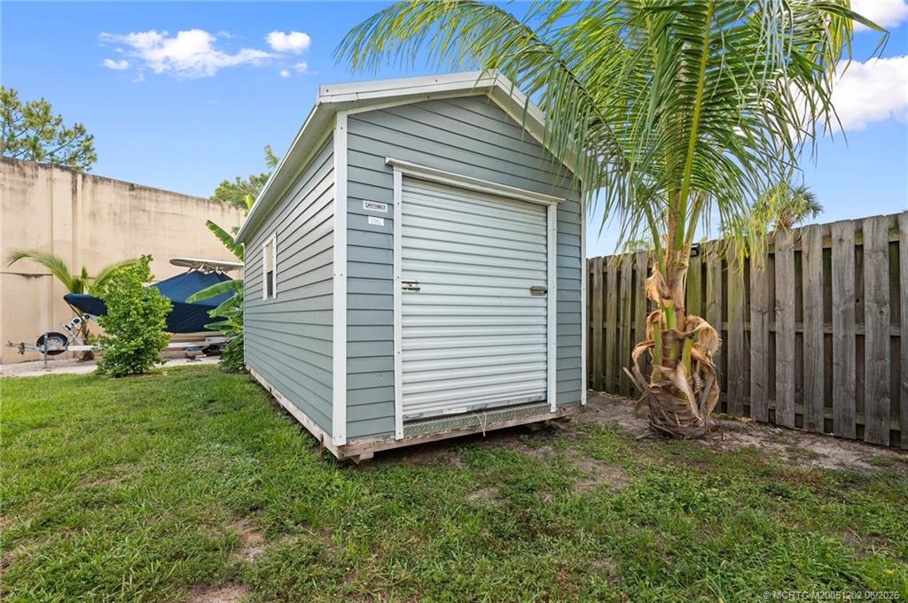 6351 Adams Street Jupiter, FL 33458 - Photo 39 of 42 a view of a backyard with a garden