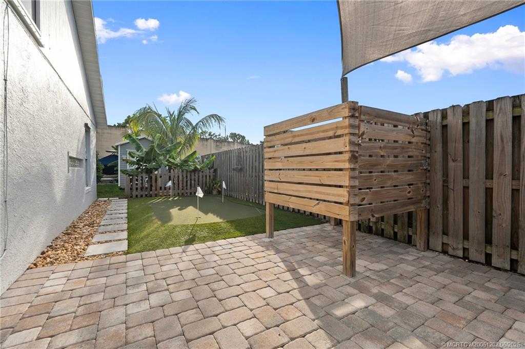 6351 Adams Street Jupiter, FL 33458 - Photo 40 of 42 a view of a backyard
