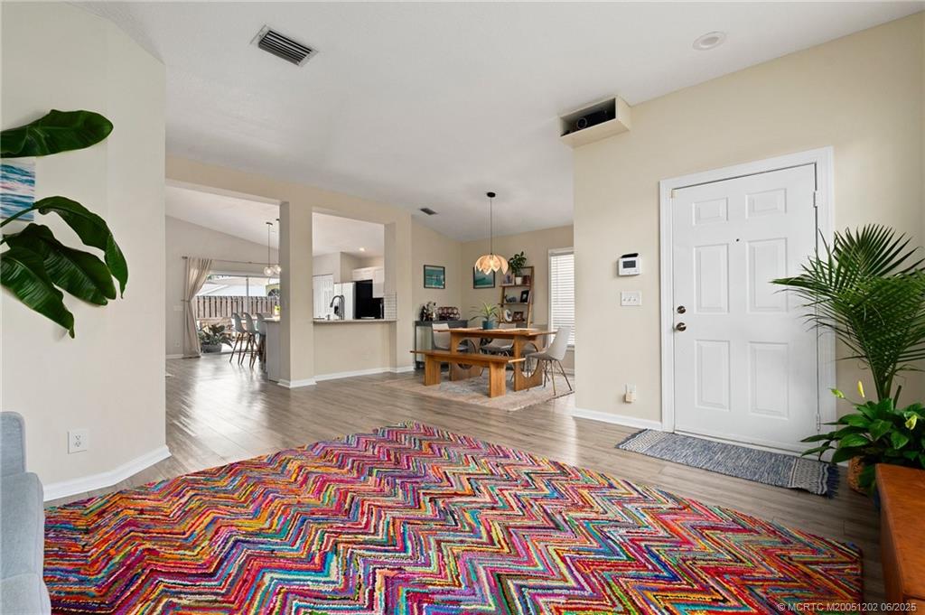 6351 Adams Street Jupiter, FL 33458 - Photo 10 of 42 a living room with furniture and a rug