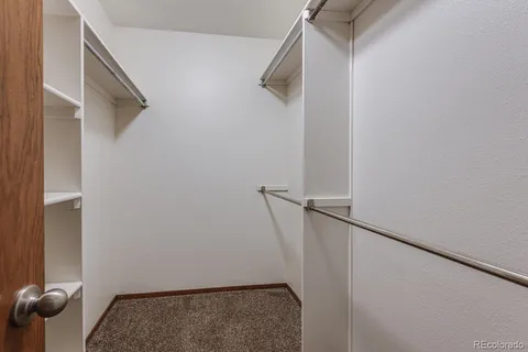 an empty room with closet area
