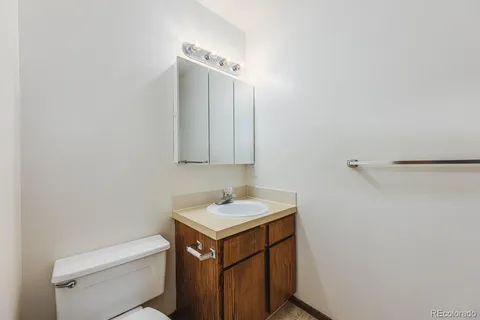 a view of a two chairs and table in the patio