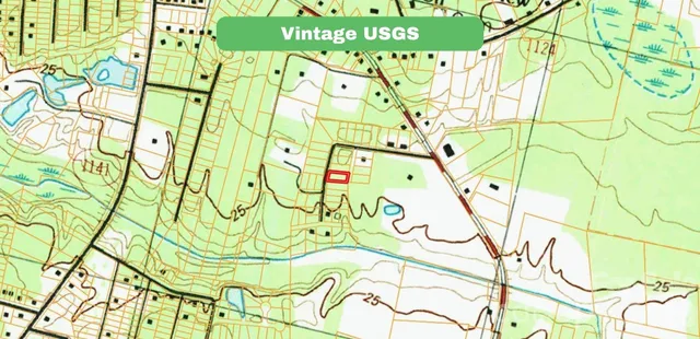 a sign that is sitting next to a small yard