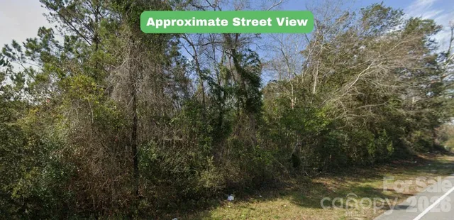 a sign that is sitting on a brick wall