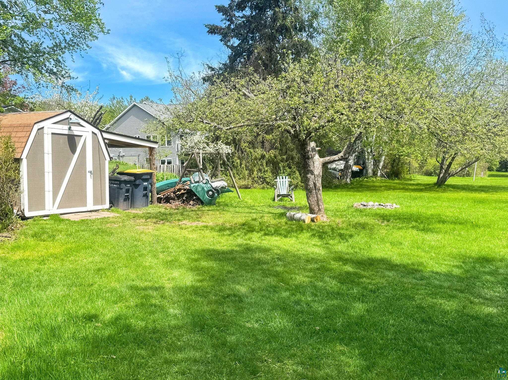 303 East 5th Street Washburn, WI 54891 - Photo 8 of 34 Expansive green lawn featuring mature trees