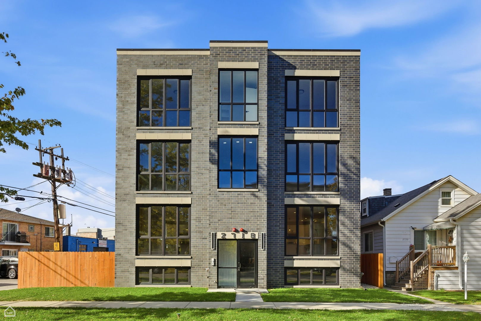 a view of a building with a yard