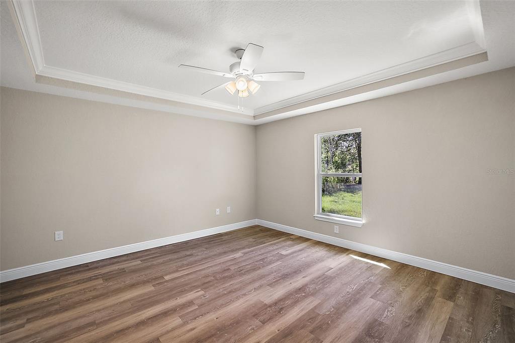 84 Pecan Run Ocala, FL 34472 - Photo 16 of 24 wooden floor in an empty room with a window