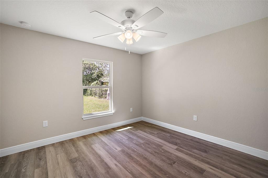 84 Pecan Run Ocala, FL 34472 - Photo 21 of 24 wooden floor in an empty room with a window