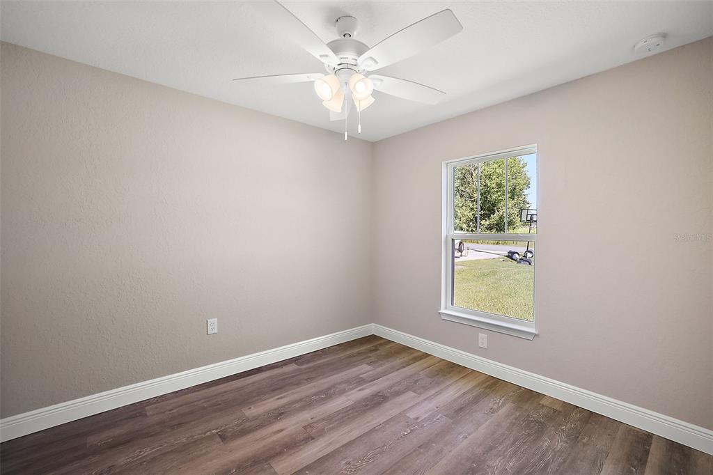 84 Pecan Run Ocala, FL 34472 - Photo 22 of 24 an empty room with a window and a fan