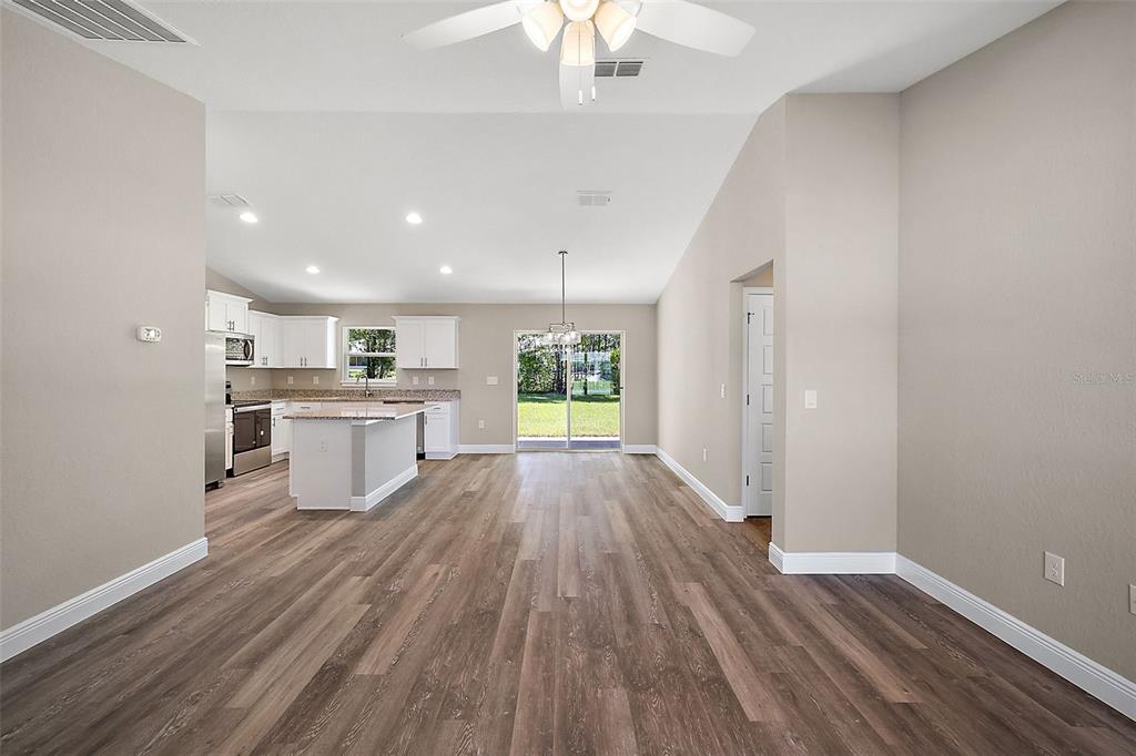 84 Pecan Run Ocala, FL 34472 - Photo 7 of 24 a view of a kitchen with wooden floor and window