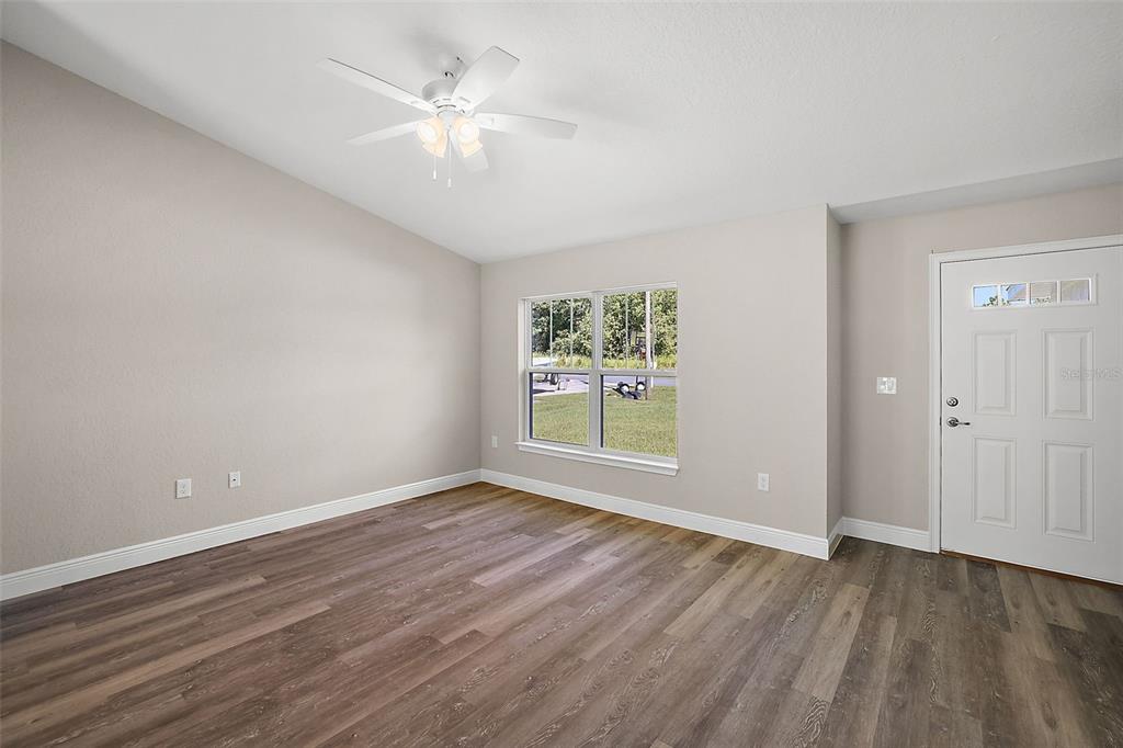 84 Pecan Run Ocala, FL 34472 - Photo 10 of 24 wooden floor in an empty room with a window