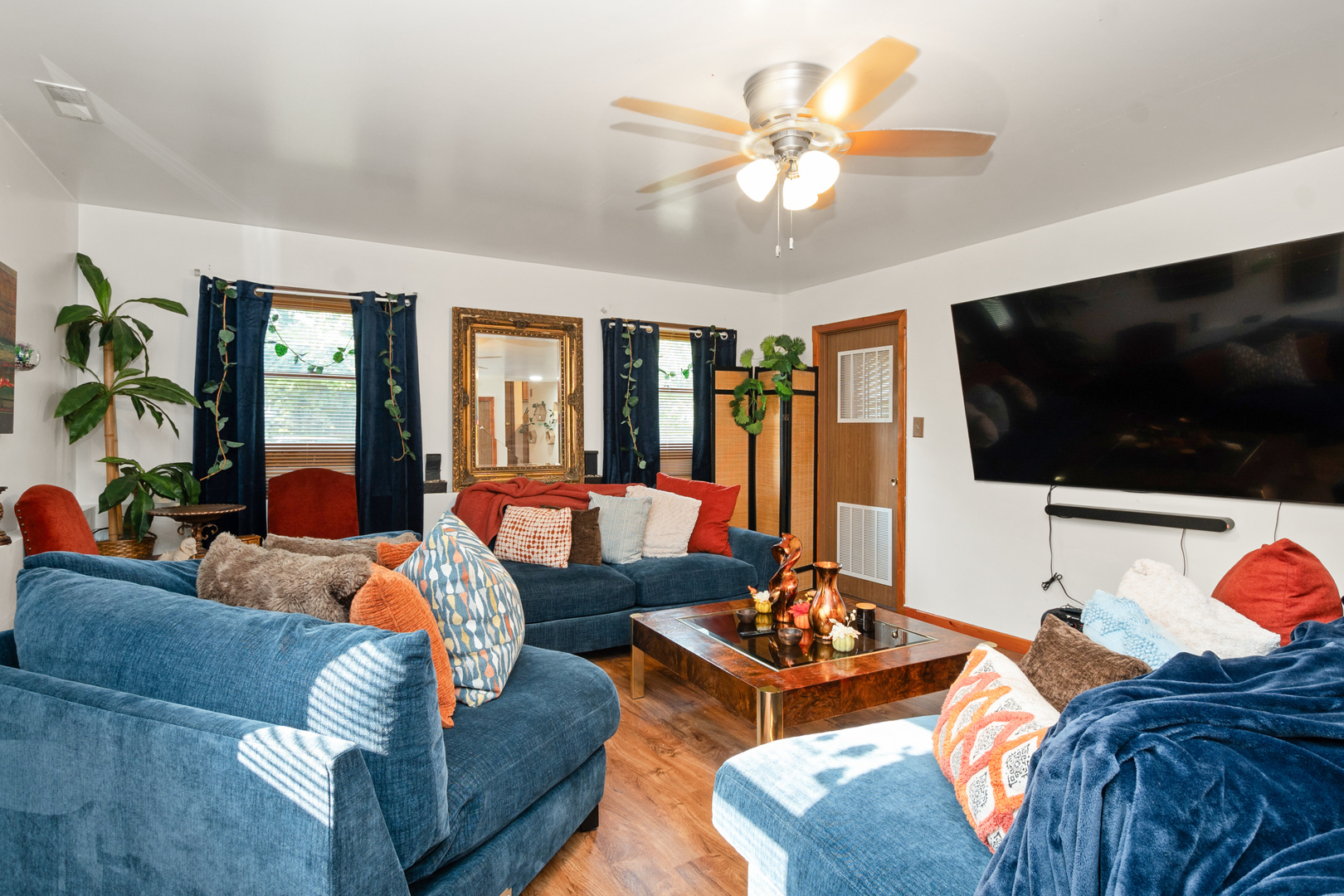 928 East 153rd Street Phoenix, IL 60426 - Photo 13 of 24 a living room with furniture and a flat screen tv