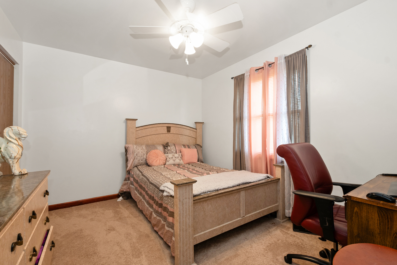 928 East 153rd Street Phoenix, IL 60426 - Photo 20 of 24 a bedroom with a bed chair and a window