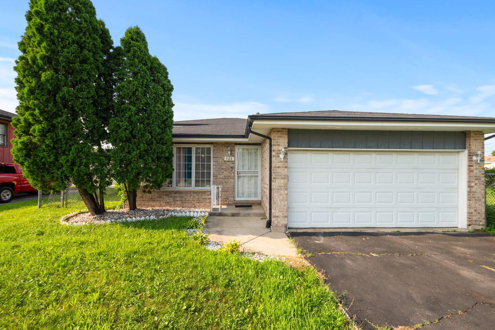 928 East 153rd Street Phoenix, IL 60426 - Photo 2 of 24 a house view with a garden space