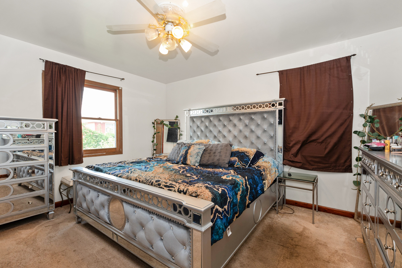 928 East 153rd Street Phoenix, IL 60426 - Photo 22 of 24 a bed room with a bed and a window