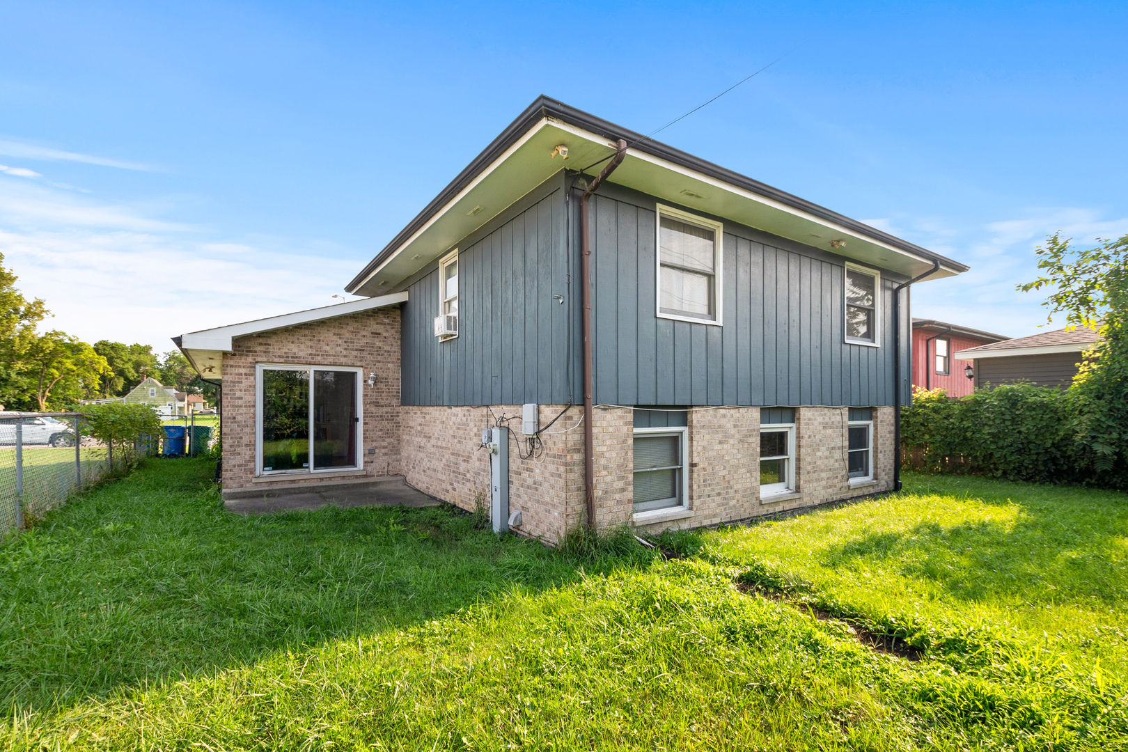 928 East 153rd Street Phoenix, IL 60426 - Photo 23 of 24 a view of a house with backyard and garden