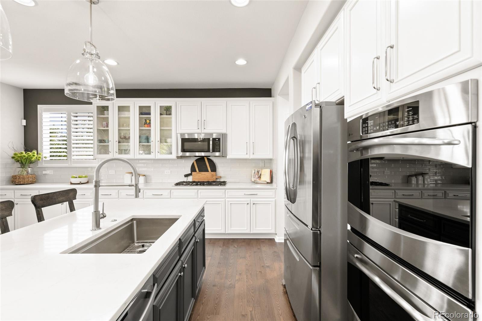 10415 Startrail Court Highlands Ranch, CO 80126 - Photo 15 of 49 a kitchen with a refrigerator stove and sink