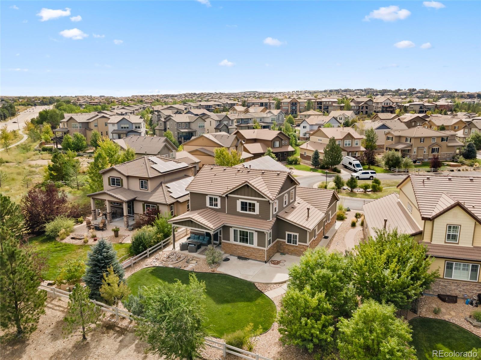 10415 Startrail Court Highlands Ranch, CO 80126 - Photo 2 of 49 an aerial view of residential houses with city view