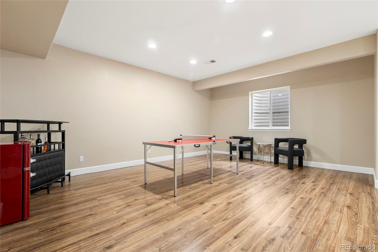10415 Startrail Court Highlands Ranch, CO 80126 - Photo 37 of 49 a room with furniture and wooden floor